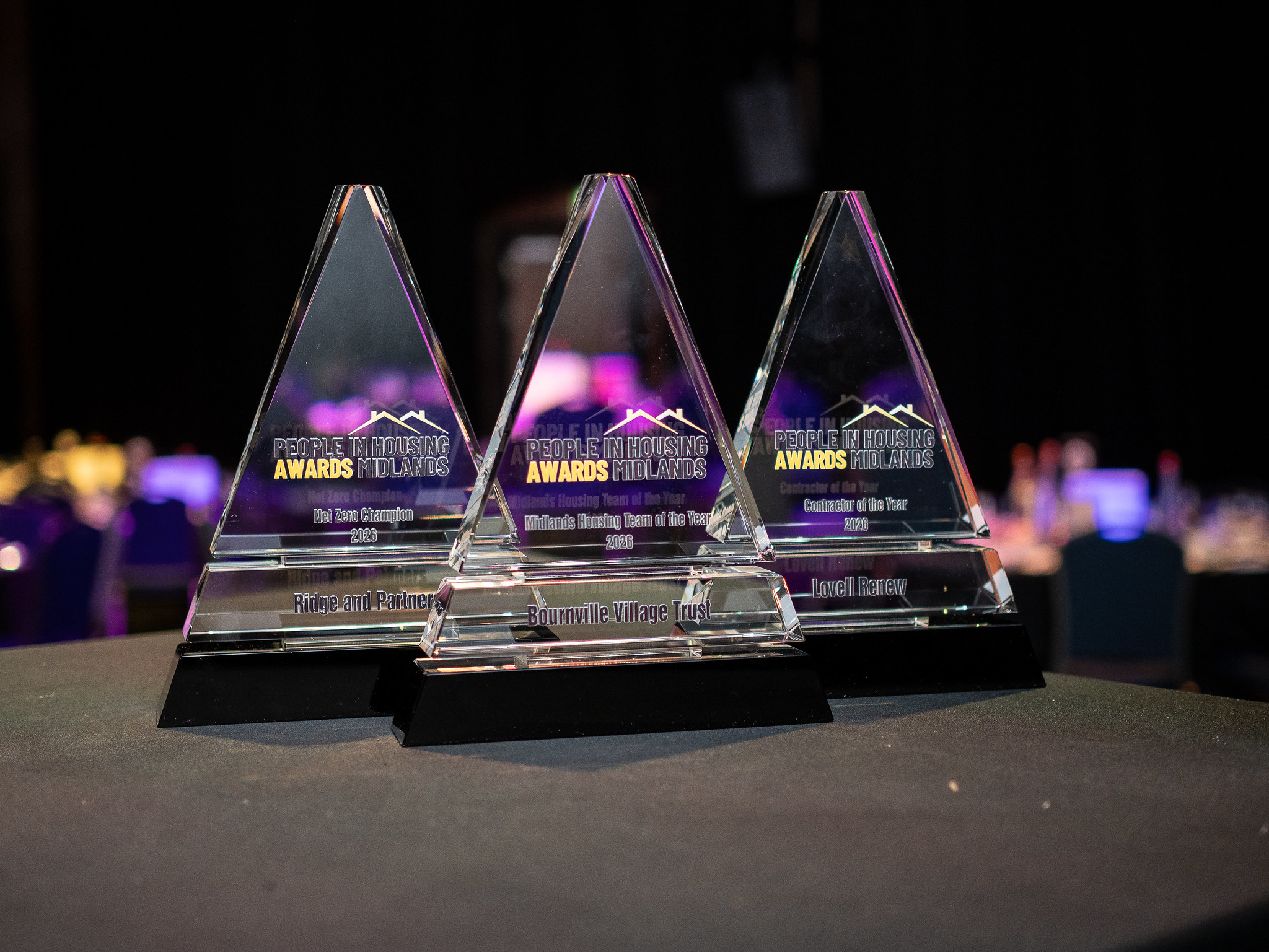 People in housing awards trophies.webp